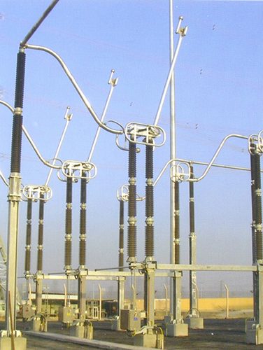 Outdoor substation yard with high-voltage isolators and steel supports